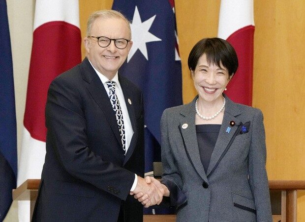 PM Albanese and PM Takaichi shake hands as the Japan-Australia alliance reaches a historic milestone.