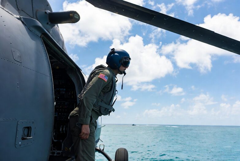 U.S. Navy Crew Member Scanning Caribbean Waters During Anti-Cartel Patrol.
